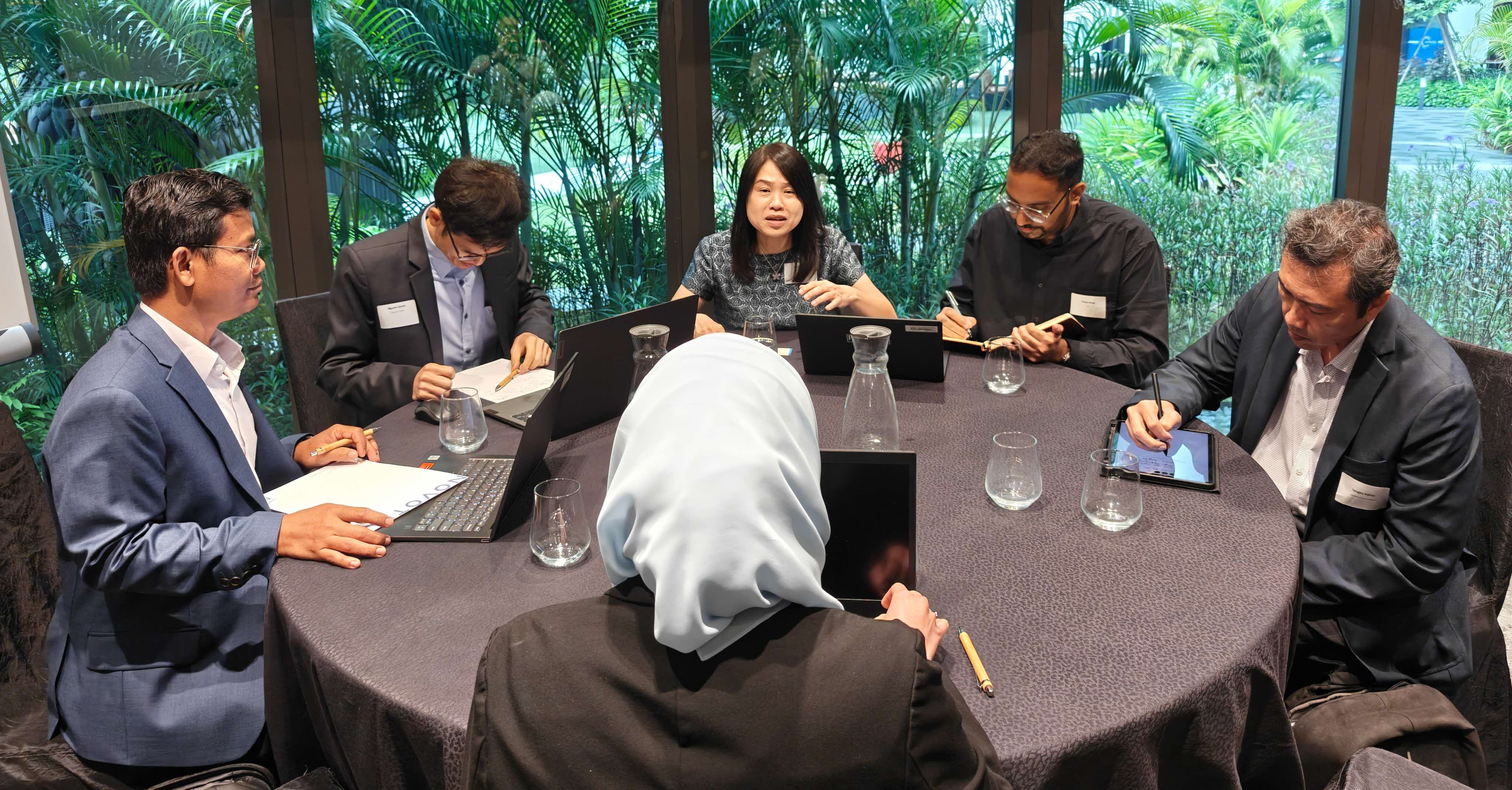 A group of people seated around a table.